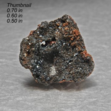 Durangite Crystals on Hematite Location: Thomas Range Juab Co. Utah.